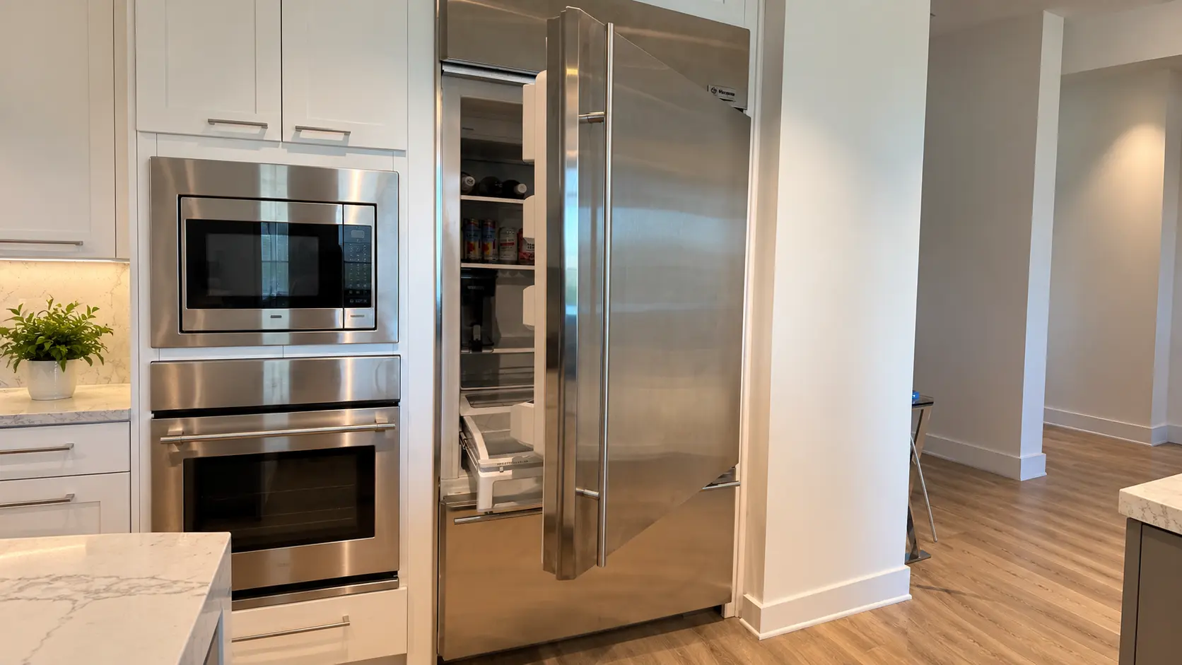 Full view of a GE Monogram built-in refrigerator serviced in Irvine after a frozen air duct restricted cooling