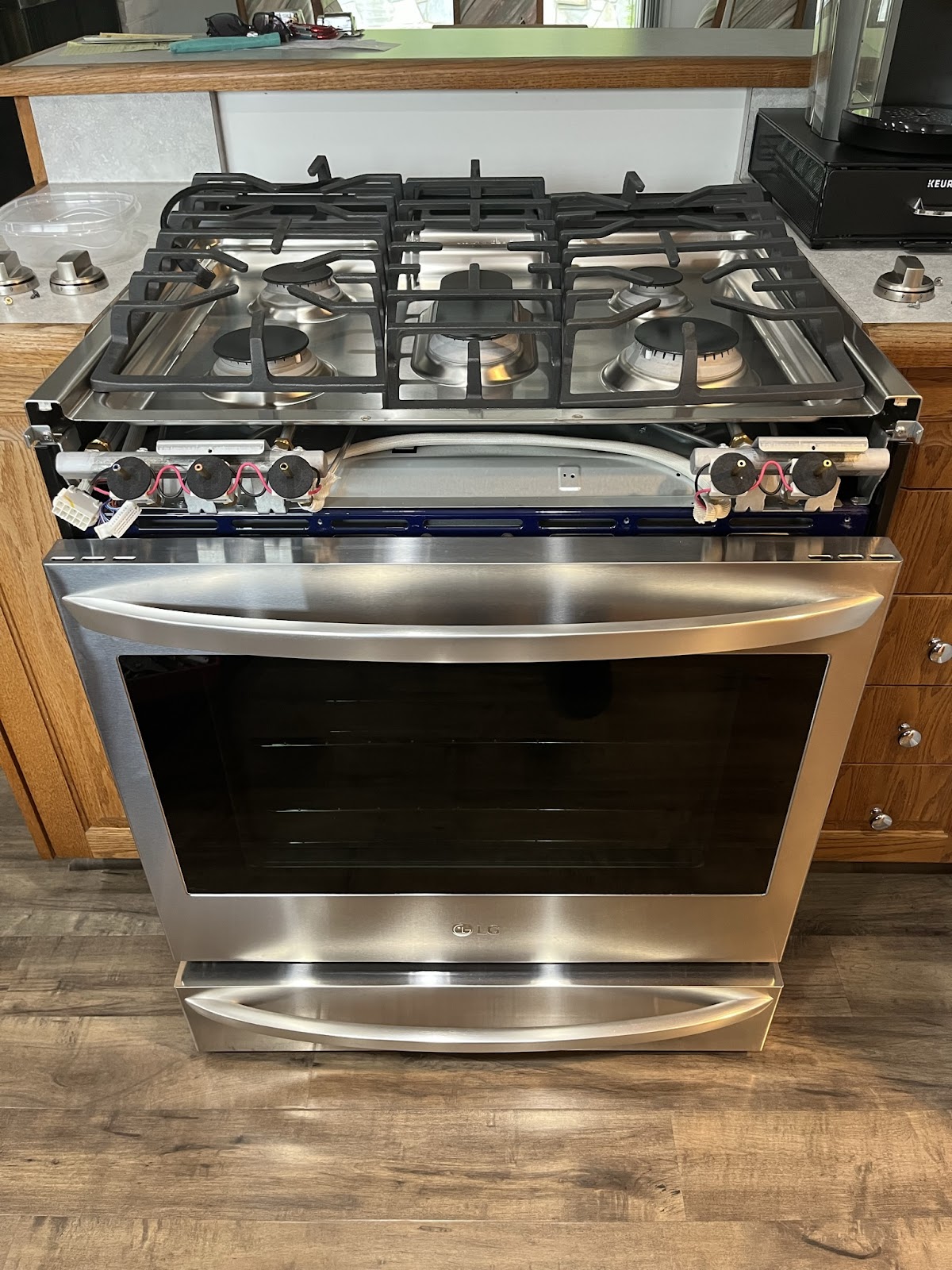 LG range repaired after a shorted spark switch caused continuous clicking